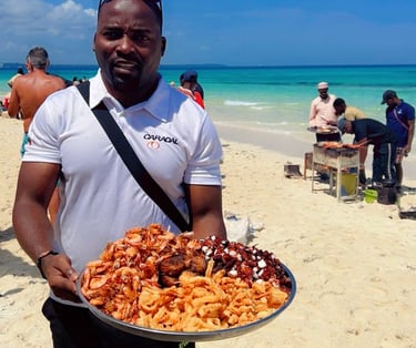 Fresh seafood cooked live outdoors at Nakupenda Sandbank, Zanzibar, providing a unique dining experience by the sea