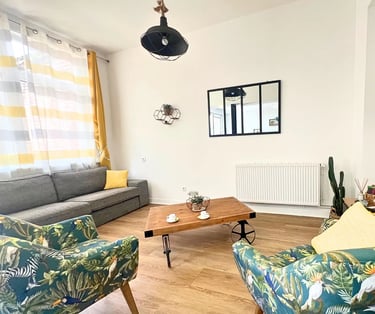 Cozy lounge with TV and sofa for business travelers on mid-term stays