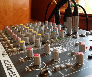 small audio mixer with connected cables