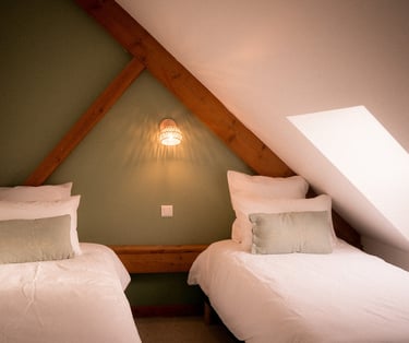 Lits de la chambre Pinson de la Ferme du Veyre