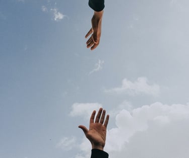 two hands reaching for collaboration