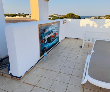 a patio with a lounge chair and a table