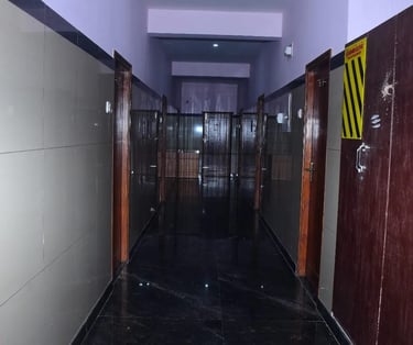 Clean and well maintained corridor at Hotel Aishwariyam Thirukadaiyur hotel near temple