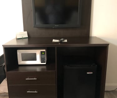 a microwave and a refrigerator in a room