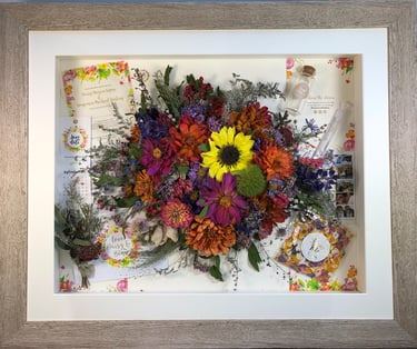 memory box full of wedding items and Birdseye preserved wedding bouquet flowers