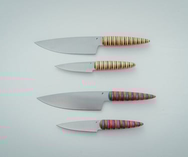 Kitchen knives on a white surface