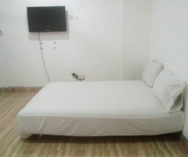 Affordable Bedroom at Denco Lodge Nungua, in Ghan fully equipped with flat screen and other accessor