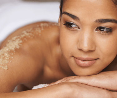 a woman enjoy body scrub at Kayuh Spa