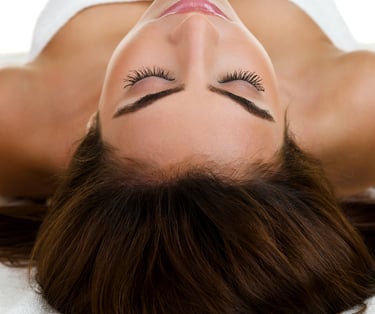 A woman getting prepared to have spa treatment at Kayuh Spa