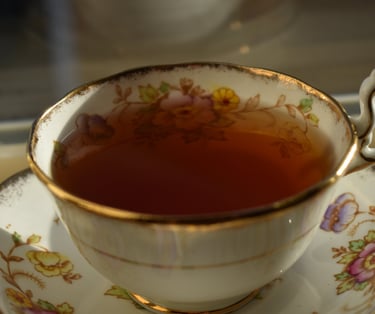 A closeup of a cup of Mountain Tea Leaves tea