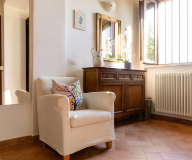 a chair with a pillow on it in a room