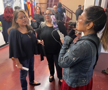 Nonprofit client is interviewed at Art Exhibit after media training
