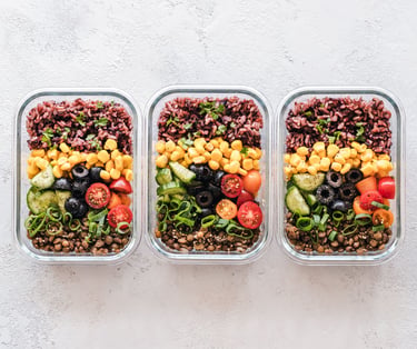 An image of a meal portioned into three containers.