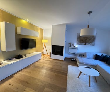 a living room with a couch and a television