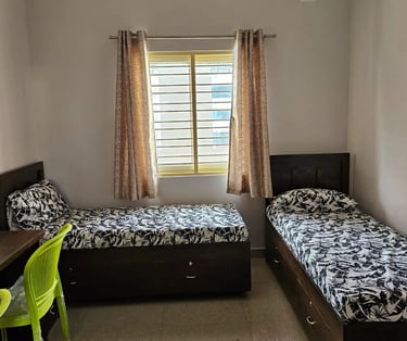 Cozy and Modern twin-sharing room.