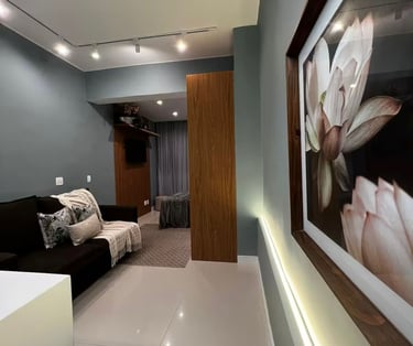 a living room with a couch and a picture frame
