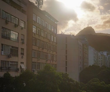 a city street scene with a clock tower in the background