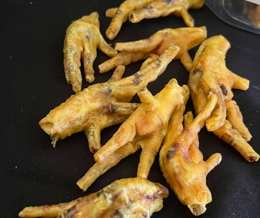 a bunch of chicken wings that are sitting on a table