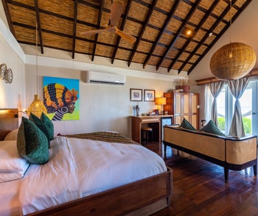 a bedroom with a bed and a couch