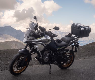 a motorcycle parked on a mountain side