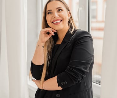 a woman in a black jacket and a white shirt