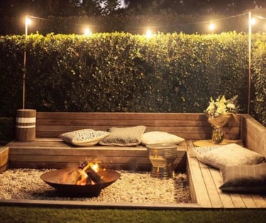 a sunken fire pit with benches