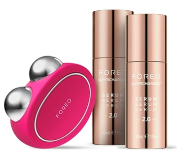age defying facial device bundle with one pink device and two bottles of treatment