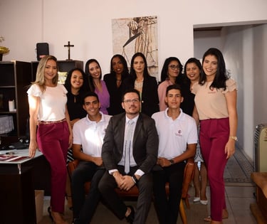 a group of people standing around a table