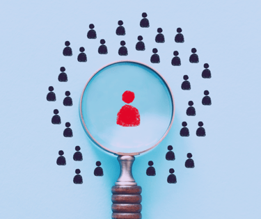 image of magnifying glass focusing on a stand out candidate