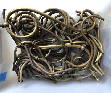 Metal parts in a sculptor's workshop bin, image 5.