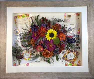 memory box full of wedding items and Birdseye preserved wedding bouquet flowers