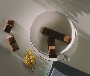 tea cup with chocolate pieces inside next to a 2021 journal