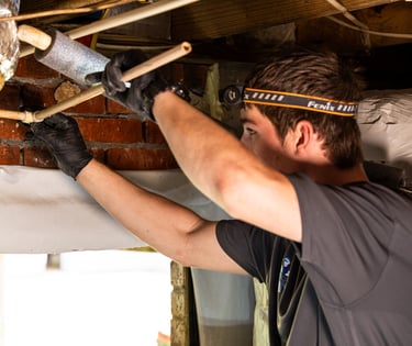 Caleb Smith rerouting PVC pipes