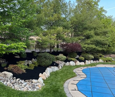 excellent landscaping and hardscaping of grass, stones and trees by NP Landscaping