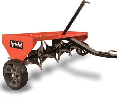 Agri-Fab tow-behind plug aerator with sharp steel tines for lawn soil aeration.