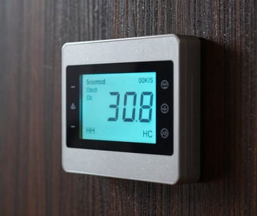 A close-up of a premium digital thermostat with a glowing electric cyan display, mounted on a dark textured wood wall