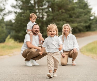 a family of three children walking down a path