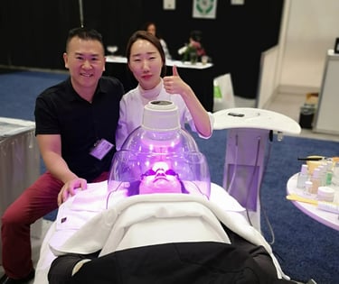Calgary laser health owner Tony Khuu smiling with laser skin client at laser skin convention