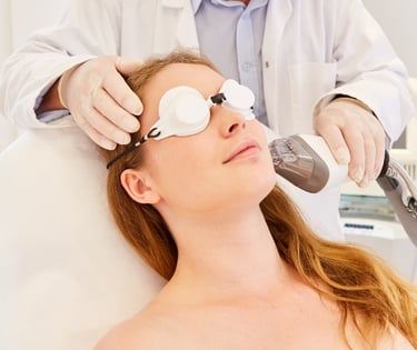 woman getting fraxel laser treatment on face