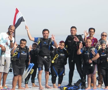 a group of people standing on a dock with a flag