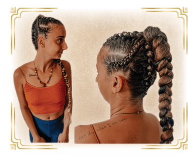 a woman with her hair done for a festival with braids and cornrows
