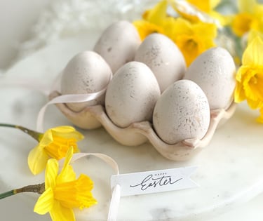 a plate with eggs and flowers on it