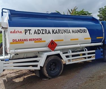 a truck with a blue and white tank top