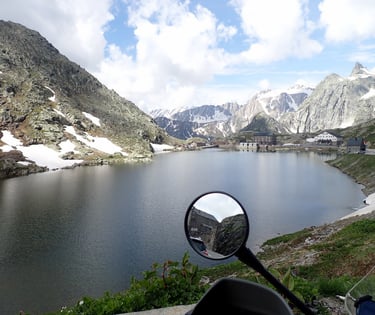 a motorbike parked in front of a mountain Mont Blanc