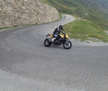 a person riding a motorcycle on a winding road