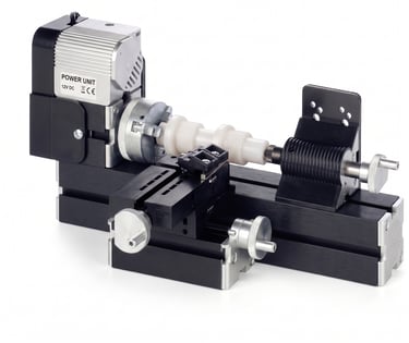Student turning a custom wooden pen body on a heavy-duty lathe.