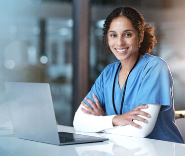 A female clinician with a computer