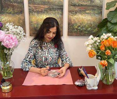 Radhika, artist behind Bella Calligraphy engraving a perfume bottle