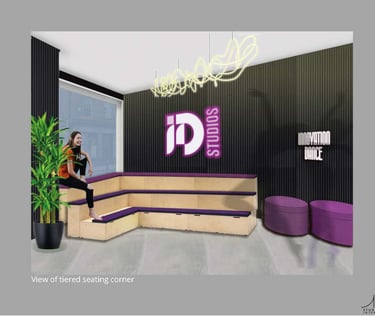 a woman sitting on a couch in a waiting area. stadium bench seats