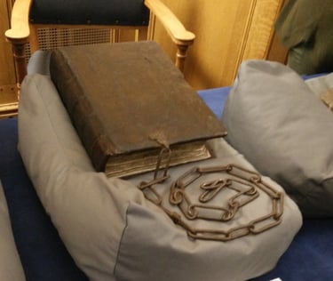 A bound manuscript with a chain.
